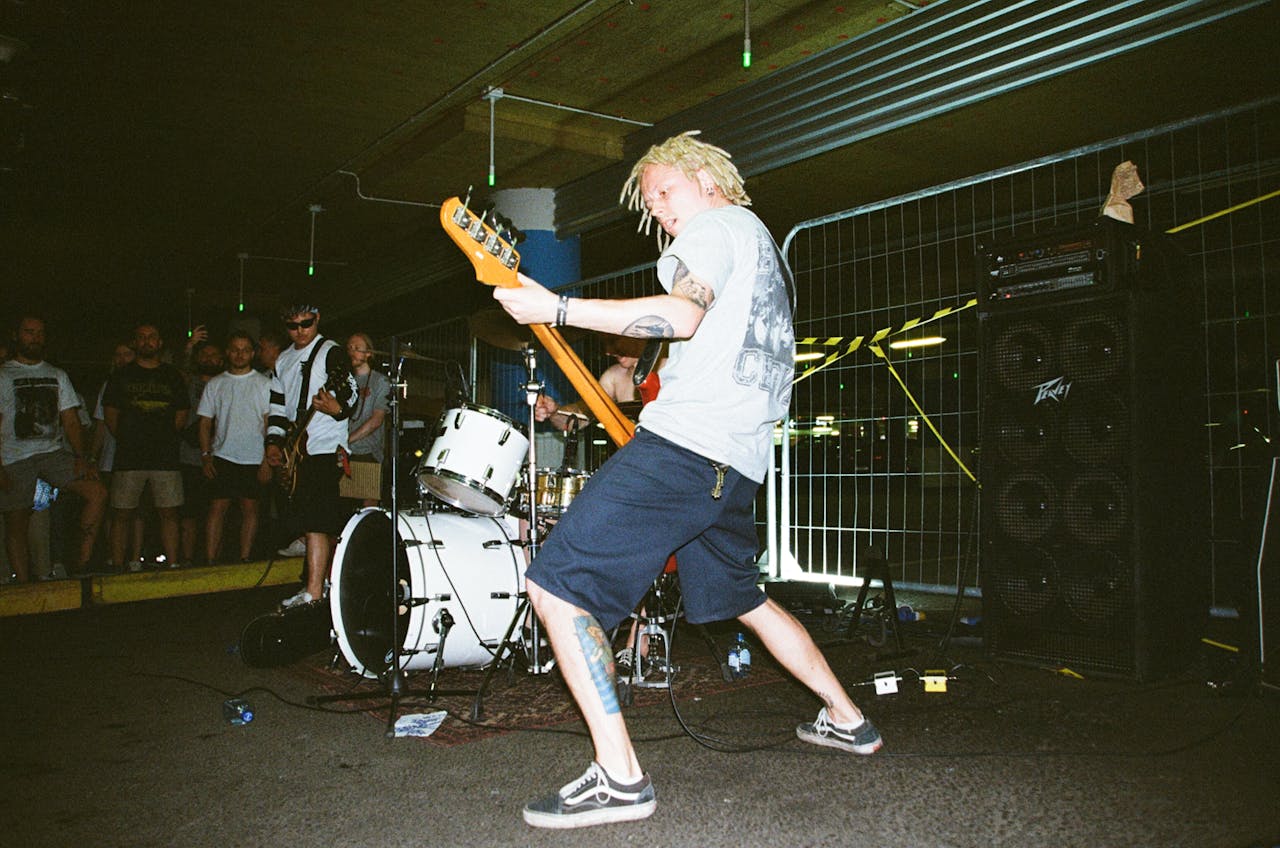 Dynamic live music performance with a band playing in an urban parking lot.